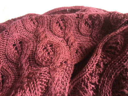 Close-up photo of knitted crumpled textured surface background