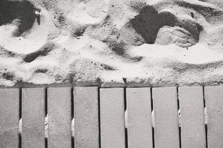 Close up on aged wooden board sandy natural surface background. Grungy textureの写真素材