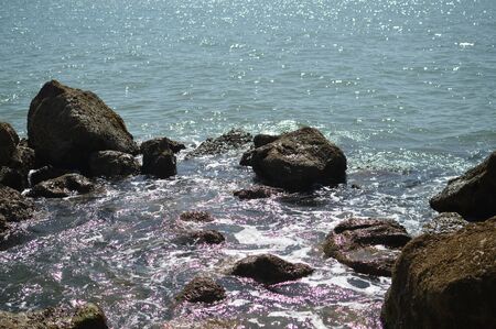 Sunny panoramic view of the ocean with rocks, seascape natural outdoors backgroundの写真素材