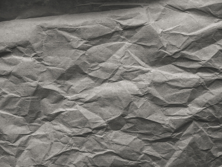 Macro closeup on textured crumpled paper backgroundの写真素材