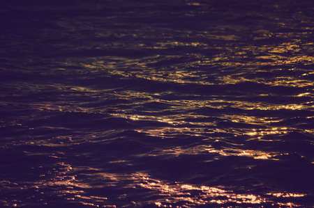Sunny water blurred ocean wave sunset outdoor coastline backgroundの写真素材