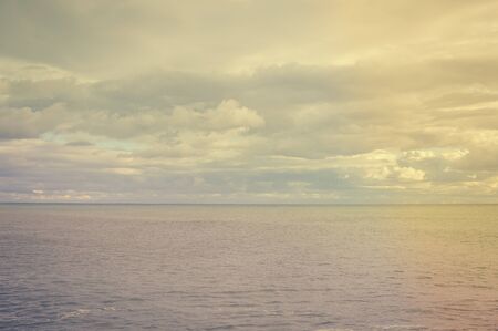 Abstract blurred ocean environment shiny colorful sunlight background. Travel vacation seasonal bright mood seascape glowing abstractionの写真素材