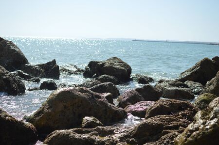 Sunny panoramic view of the ocean with rocks, seascape natural outdoors backgroundの写真素材