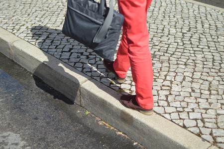 Woman walking zebra crossing outdoors background. Safe commuting sidewalk travel ransportationの写真素材