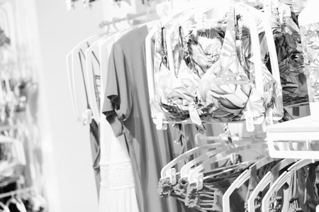 Fashion underwear, clothing hanging on hangers. Closeup on group of accessory, household showroom departmentの写真素材