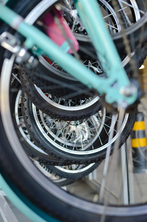 Close up on detail of modern bicycles. Sports shop, factory warehouse, repair station workshop abstract mobility technology background.の写真素材