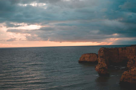 Beautiful cliffs and sea coastline outdoors natural background Portugal Europe. Recreational tourism inspirational scenery photographの写真素材