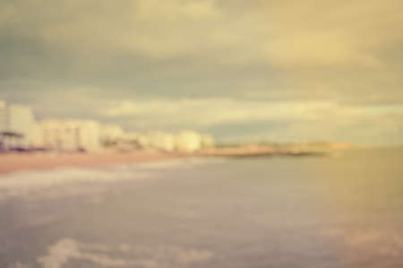 Defocused blurry beautiful sea coastline sun rays light outdoors natural background. Recreational tourism inspirational scenery photographの写真素材