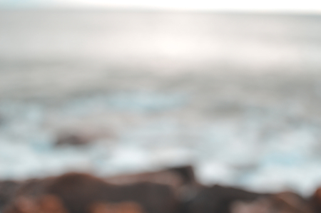 Defocused blurry beautiful sea coastline sun rays light outdoors natural background. Recreational tourism inspirational scenery photographの写真素材