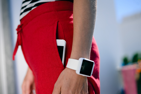 Close up on unrecognizable person holding using mobile phone, abstract modern communication technology background. Busy lifestyle, play game, social network, market strategy, shopping onlineの写真素材