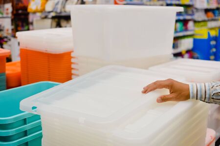 Close up on person going shopping checking or choosing, business shelf service background. Selecting container, factory packaging, goods merchandise purchase, relocation moving processの写真素材