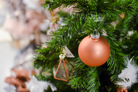 Decorated Christmas tree on joyful festive shiny blurred background, closeup image. Seasonal traditional bright joy, elegant natural classy mood, love and peace jolly designの写真素材