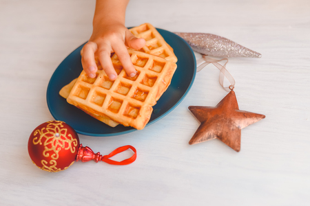 Top side view of delicious homemade waffles with a Christmas theme. Classic culinary styling close up overhead photographyの写真素材