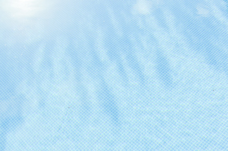 Blue swimming pool textured colorful backgroundの写真素材