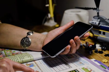 Hand of senior woman holding mobile smart phone communication technology background.の写真素材