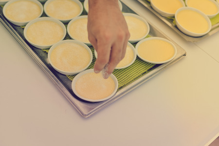 Custard making process, delicious decorated light table background, close up view
