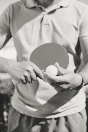 Black and white image closeup on hand playing table tennisの写真素材