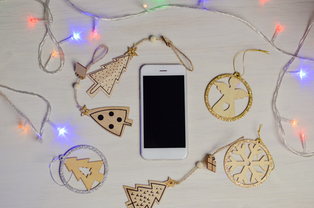 Mobile Phone in Xmas Decoration, Mockup Top View Display Background. Communication Technology Lifestyleの写真素材