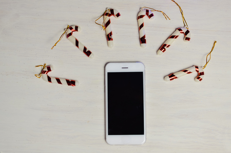 Mobile Phone in Xmas Decoration, Mockup Top View Display Background. Communication Technology Lifestyleの写真素材