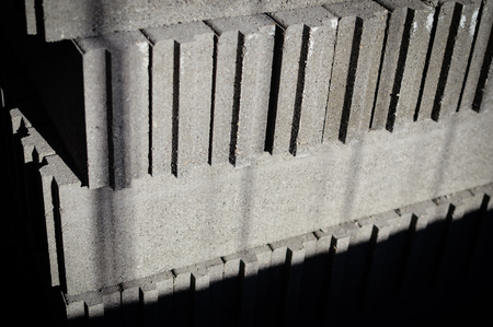 Motion blur image of cement building blocks trade stacked piled in warehouse development background.の写真素材
