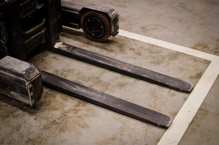 Forklift doing work in the warehouse on loading area backgroundの写真素材