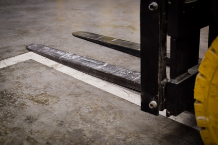 Forklift doing work in the warehouse on loading area backgroundの写真素材
