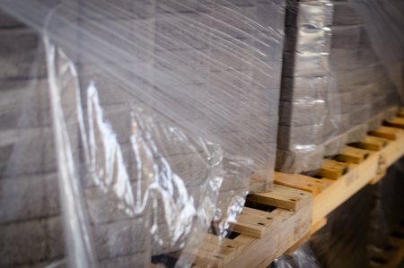 Pallet of concrete blocks tiles industrial design building materials textured background. Build work storage unitの写真素材