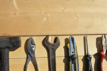 Tool set and instruments for hand work and fixing on wooden surface background. Close up top side...