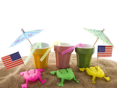 Toys and drinks on the beachの写真素材