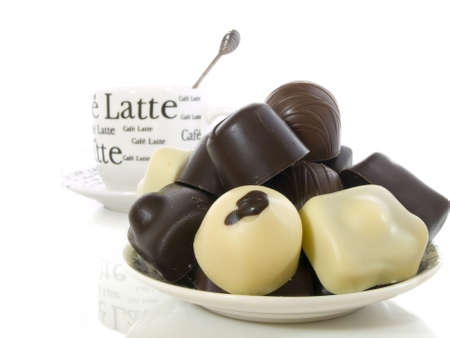 Chocolate with a cup of coffee on the background