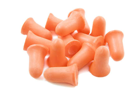 Orange earplugs isolated on a white background