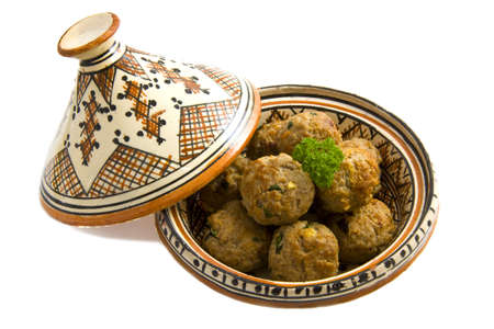 Meat balls in a handmade tajine isolated over whiteの写真素材