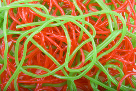 Red and green candy strings used as backgroundの写真素材
