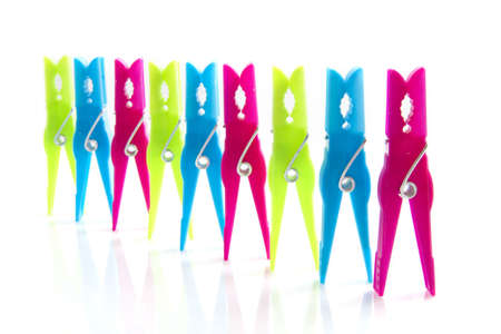 Colorful clothes pins isolated on a white background