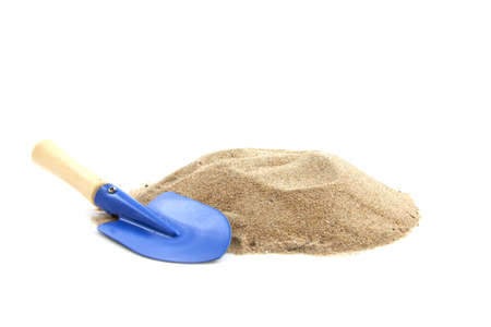 Blue spade with a pile of sand isolated over whiteの写真素材