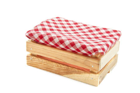 Wooden box with red white cloth isolated over whiteの写真素材
