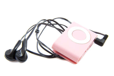 Pink mp3 player with earphones isolated over whiteの写真素材