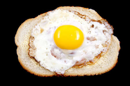 Eggs with bacon on bread isolated over white