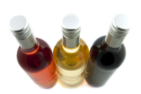 Three bottles of wine isolated over whiteの写真素材