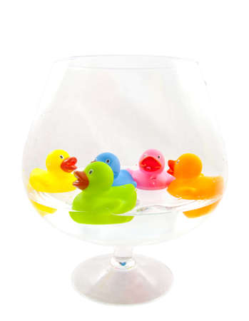 Colorful ducks swimming in a glass isolated over whiteのeditorial素材