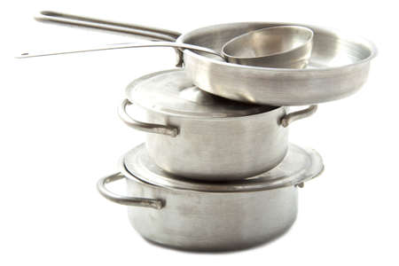 Stainless pots and pans on a pile Stainless pots and pans on a pile