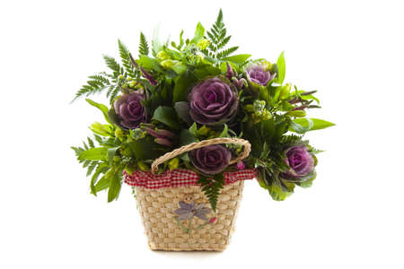 Basket with nice flowers isolated over whiteの写真素材