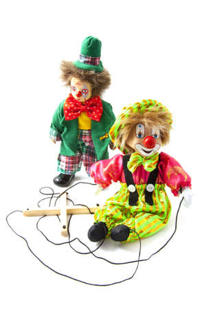 One clown and one marionette puppet over whiteの写真素材