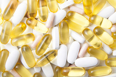 Capsules and pills on a pile for background use