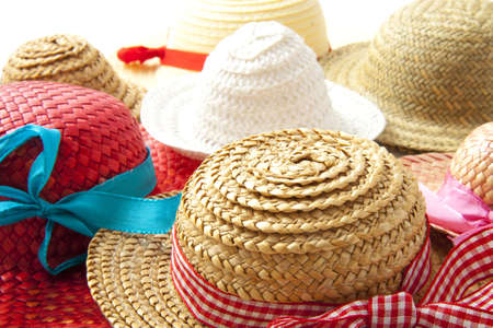 Different straw hats with ribbon for background useの写真素材
