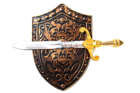Vintage shield and sword isolated over whiteの写真素材