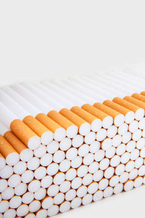Pile sigarettes close-up for background useの写真素材