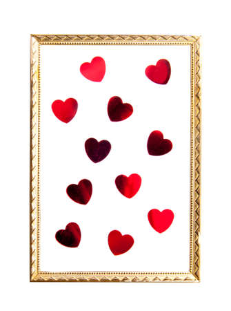Old golden frame within red hearts isolated over white