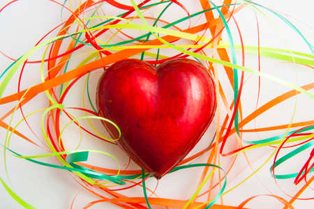 Red heart in colorful party style for background useの写真素材