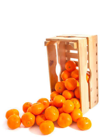 Wooden crate fresh tangerines isolated over whiteの写真素材